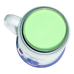 Green paint sample in a open paint can on a white background