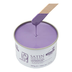 Can of satin smooth lavender wax with a wooden spatula dipping into the wax.