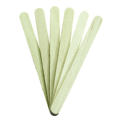 Set of green wooden sticks on a white background