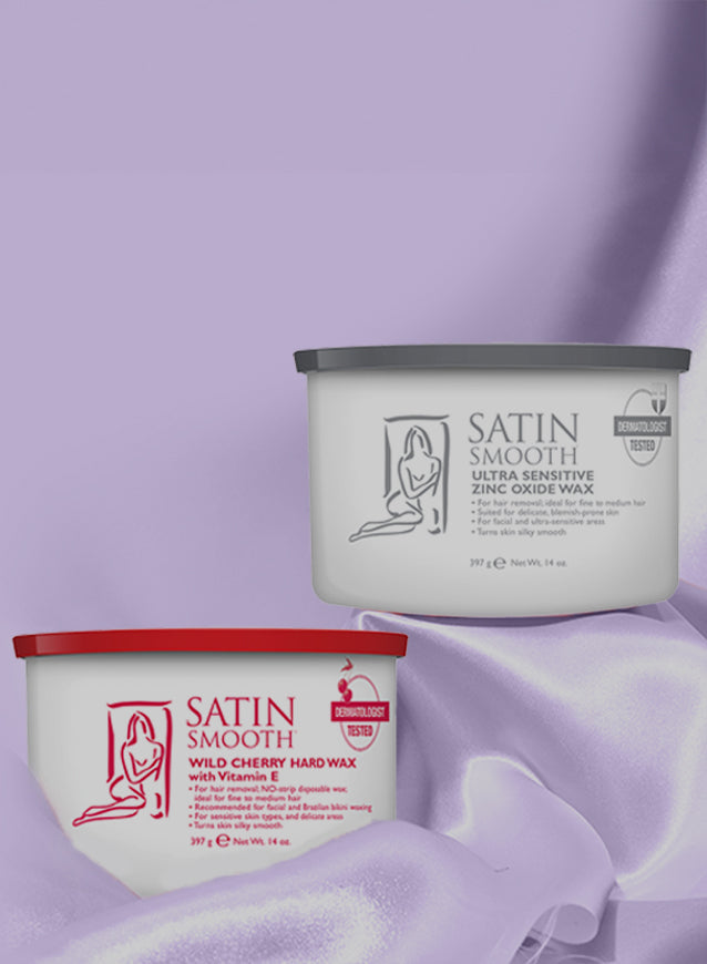Two containers of Satin Smooth wax on a purple fabric background