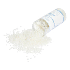 Open container of white beads with a white background