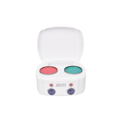 Makeup compact with pink and green shades on a white background