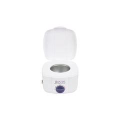 open wax warmer on a white background