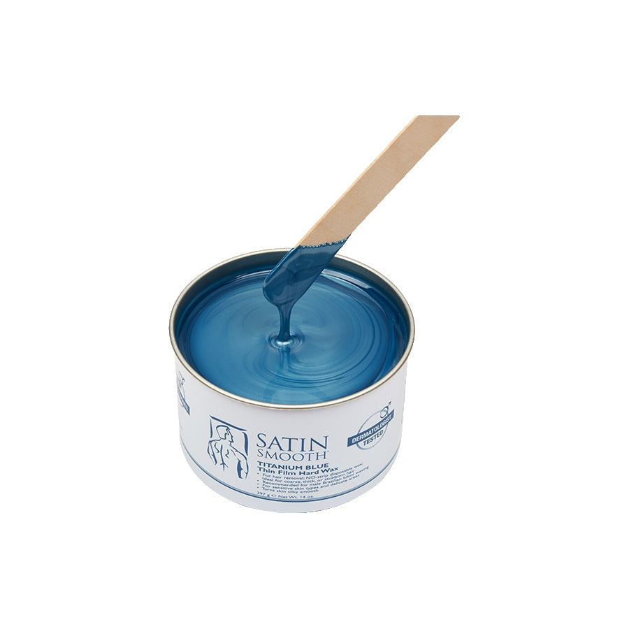 Can of blue paint with a wooden stir stick on a white background
