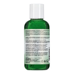 Green bottle with white cap on a white background