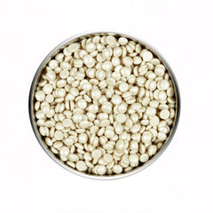 Top view of an open cylinder can of Satin Smooth PEBBLES WAX™ Ultra Sensitive Zinc Oxide Thin-Film Flex Wax solid wax beans