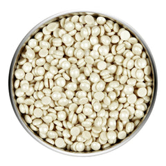 Satin Smooth Pebble Wax in a metal bowl on a white background