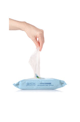 An expansive view of a woman handpicked a wet cleanser wipes in the package 