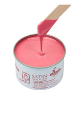 Dripping wax stick dipped into open can of Satin Smooth Cherry Hard Wax with Vitamin E showing its color & texture