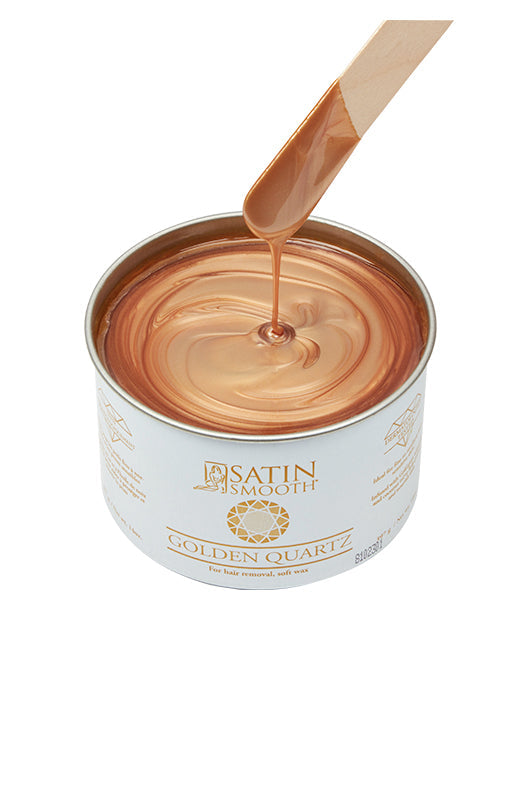 Dripping wax stick dipped into open can of Satin Smooth Golden Quartz Wax showing its full color & texture