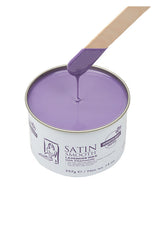 Dripping wax stick dipped into open can of Satin Smooth Lavender wax showing its full creamy purple color & texture