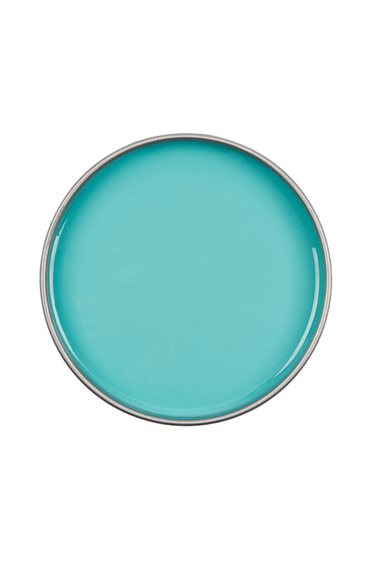 Top view of an open can of Satin Smooth Tea Tree Wax showing its creamy light green color