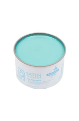 Angled top view of a 14 ounce can of Satin Smooth Tea Tree Wax displaying its contents